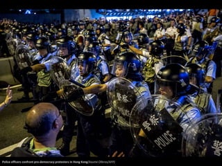 Police officers confront pro-democracy protesters in Hong Kong(Xaume Olleros/AFP) 
 