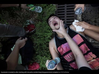 A protester is tended to after clashing with riot police outside Hong Kong government complex(Lam Yik Fei/Getty) 
 