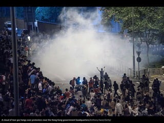 A cloud of tear gas hangs over protesters near the Hong Kong government headquarters(Anthony Kwan/Getty) 
 