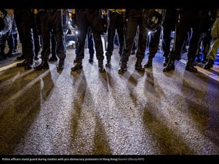 Police officers stand guard during clashes with pro-democracy protesters in Hong Kong(Xaume Olleros/AFP) 
 