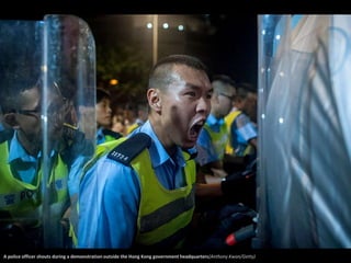 A police officer shouts during a demonstration outside the Hong Kong government headquarters(Anthony Kwan/Getty) 
 