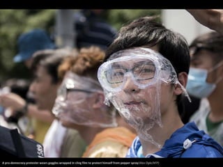 A pro-democracy protester wears goggles wrapped in cling film to protect himself from pepper spray(Alex Ogle/AFP) 
 