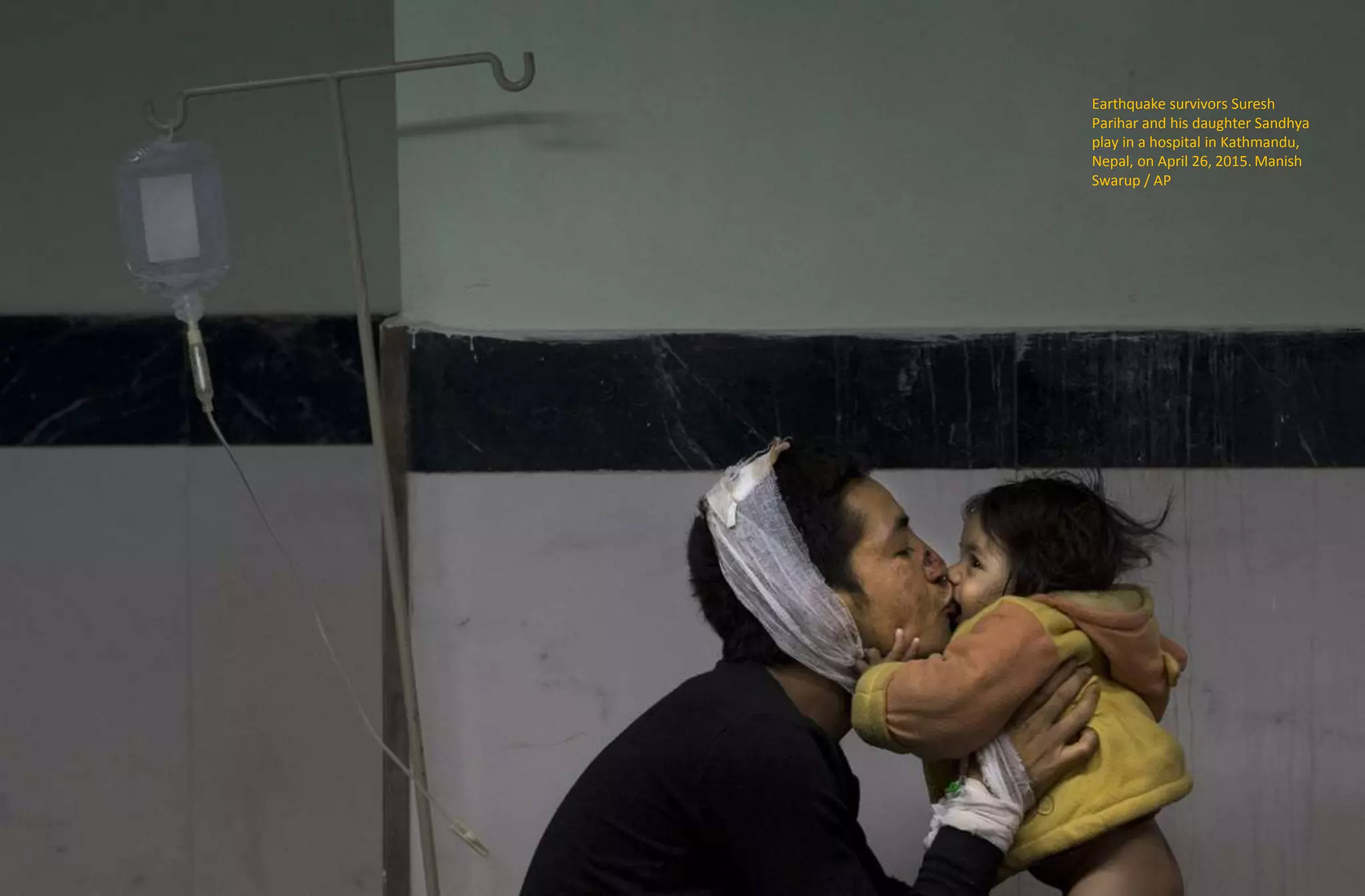 Earthquake survivors Suresh
Parihar and his daughter Sandhya
play in a hospital in Kathmandu,
Nepal, on April 26, 2015. Manish
Swarup / AP
 