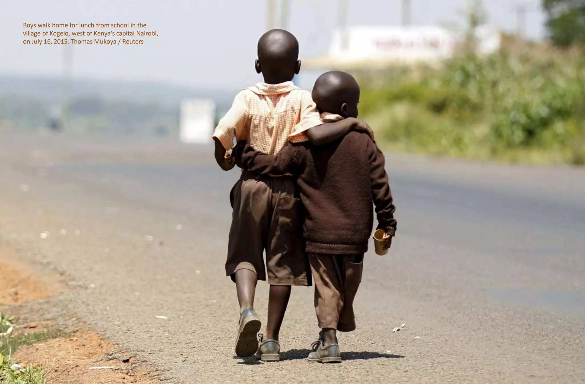 Boys walk home for lunch from school in the
village of Kogelo, west of Kenya's capital Nairobi,
on July 16, 2015. Thomas Mukoya / Reuters
 