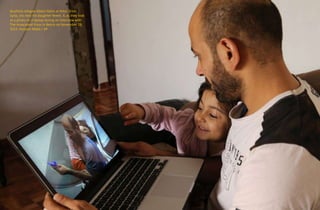 BuyPens refugee Abdul Halim al-Attar, from
Syria, sits next his daughter Reem, 4, as they look
at a photo on a laptop during an interview with
The Associated Press in Beirut on November 28,
2015. Hussein Malla / AP
 