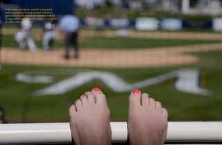 A fan relaxes during the seventh inning while
watching a spring training baseball exhibition
game between the Milwaukee Brewers and the
Chicago White Sox in Phoenix, Arizona, on March
22, 2015. Chris Carlson / AP
 