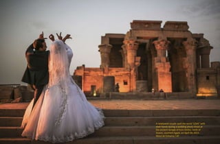 A newlywed couple spell the word "LOVE" with
their hands during a wedding photo shoot at
the ancient temple of Kom Ombo, north of
Aswan, southern Egypt, on April 30, 2015.
Mosa'ab Elshamy / AP
 