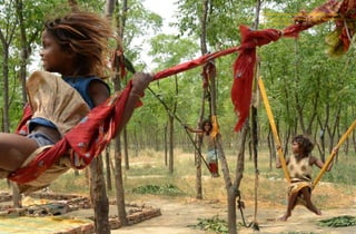 Children of laborers play on makeshift swings
in Amritsar, India, on May 12, 2015. Narinder
Nanu / AFP / Getty
 