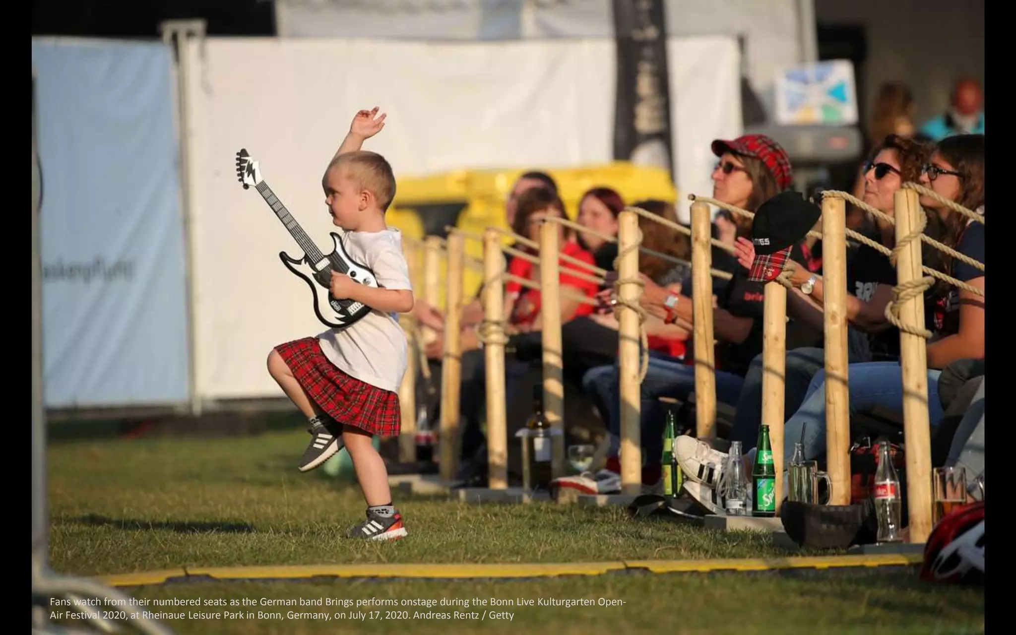 Fans watch from their numbered seats as the German band Brings performs onstage during the Bonn Live Kulturgarten Open-
Air Festival 2020, at Rheinaue Leisure Park in Bonn, Germany, on July 17, 2020. Andreas Rentz / Getty
 