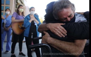 Paulino Perez (right) hugs his brother Isaias Perez Yanez, as Isaias is released from Sharp Coronado Hospital
after battli...