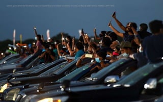 Concert-goers attend the first drive-in open-air musical show at an airport in Colombo, Sri Lanka, on May 30, 2020. Ishara...