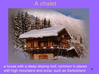 A chalet a house with a steep sloping roof, common in places with high mountains and snow ,  such as Switzerland 