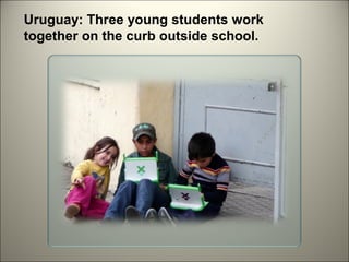 Uruguay: Three young students work
together on the curb outside school.

 