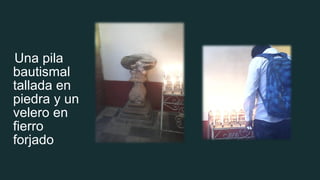 Una pila
bautismal
tallada en
piedra y un
velero en
fierro
forjado
 