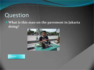 Question What is this man on the pavement in Jakarta doing ?  Answer 