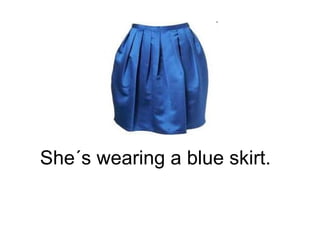She´s wearing a blue skirt. 