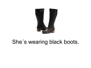 She´s wearing black boots. 