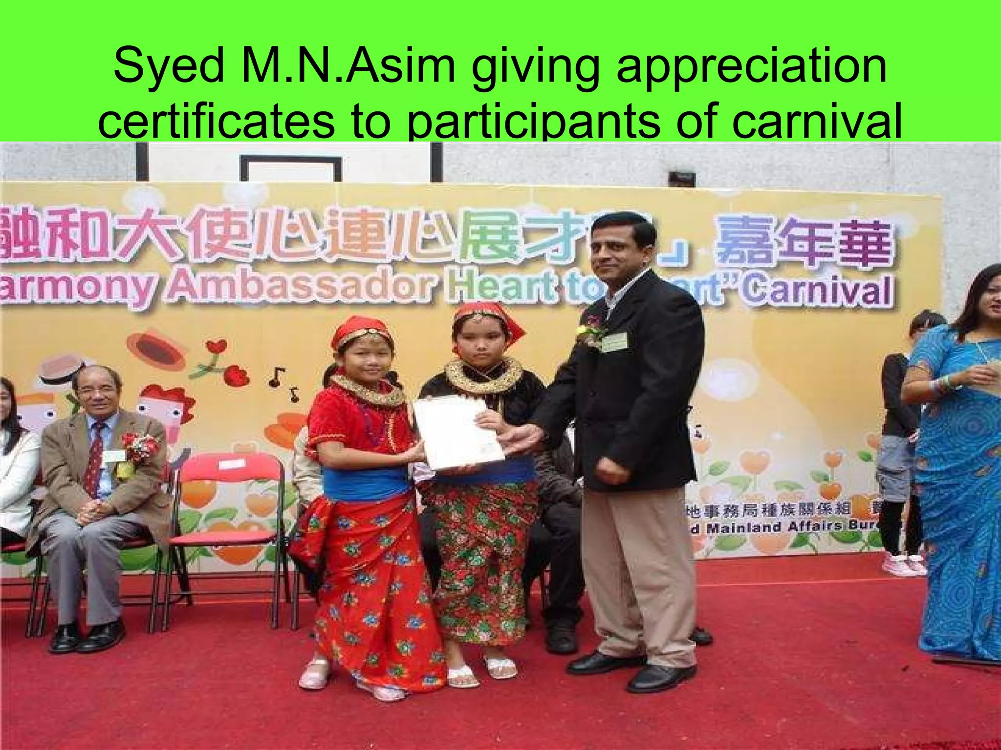 Syed M.N.Asim giving appreciation certificates to participants of carnival 