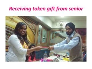 Receiving token gift from senior
 
