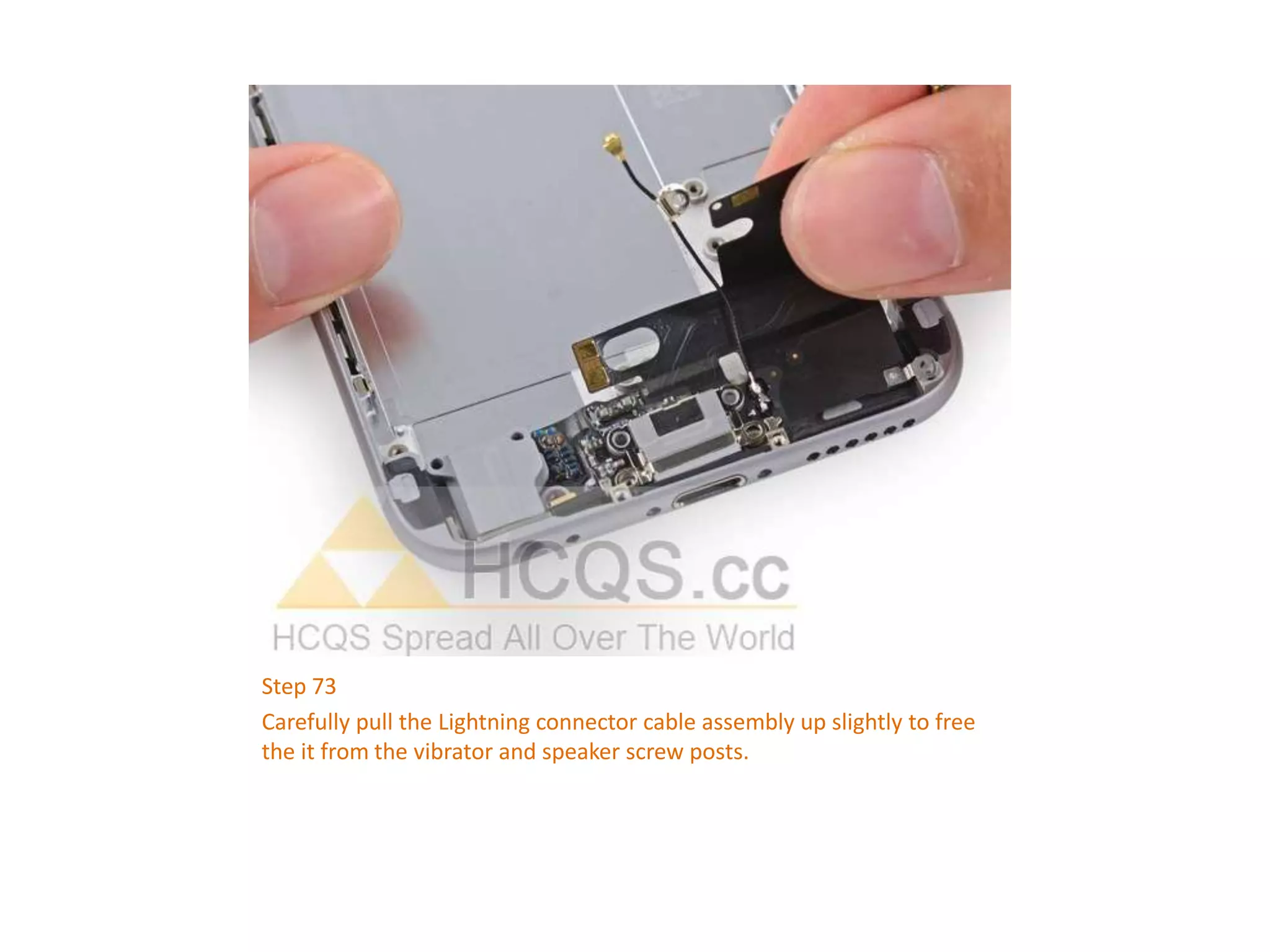 Step 73
Carefully pull the Lightning connector cable assembly up slightly to free
the it from the vibrator and speaker screw posts.
 