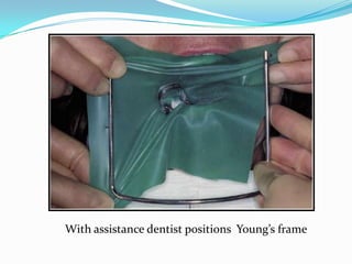 With assistance dentist positions Young’s frame
 