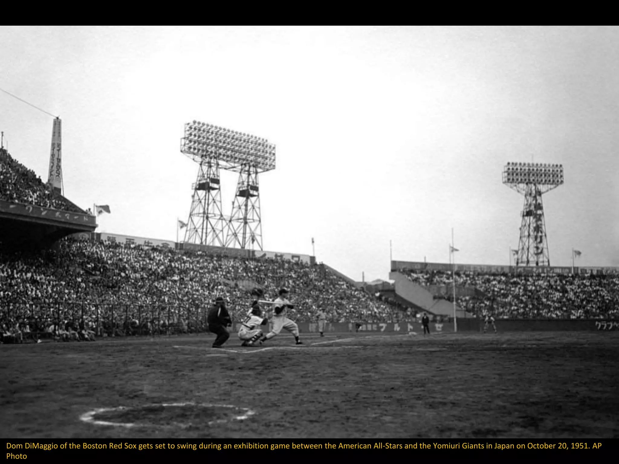 Dom DiMaggio of the Boston Red Sox gets set to swing during an exhibition game between the American All-Stars and the Yomiuri Giants in Japan on October 20, 1951. AP
Photo
 