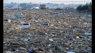 13 March 2011: Debris covers a large area in Natori, Miyagi prefectureMike Clarke/AFP
 
