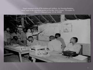 "Negro members of the 477th Antiaircraft Artillery, Air Warning Battalion, study maps in the operations section at Oro Bay, New Guinea." November 15, 1944. Pvt. Edward Grefe. 111-SC-305909 8