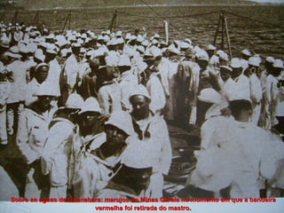 João Cândido, ao lado do marinheiro Antônio Ferreira de Andrade, lê o decreto da Anistia Sobre as águas da Guanabara: marujos do Minas Gerais no momento em que a bandeira vermelha foi retirada do mastro . 