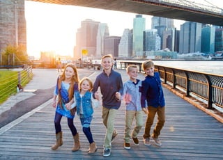Enjoy a memorable family time in New York City by exploring the iconic Brooklyn Bridge, a must-visit destination for tourists.