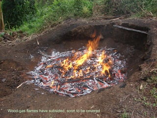Wood-gas flames have subsided, soon to be covered
 