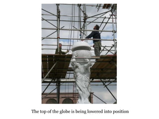 The top of the globe is being lowered into position