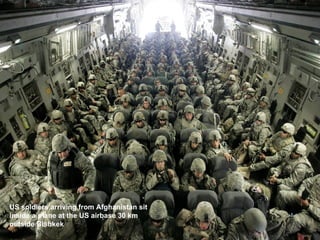 US soldiers arriving from Afghanistan sit inside a plane at the US airbase 30 km outside Bishkek  