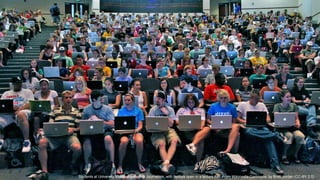 Students at University Missouri School of Journalism, with laptops open in a lecture hall. From Wikimedia Commons, by Brett Jordan (CC-BY 2.0)
 