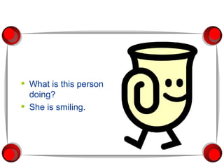 What is this person doing? She is smiling. 