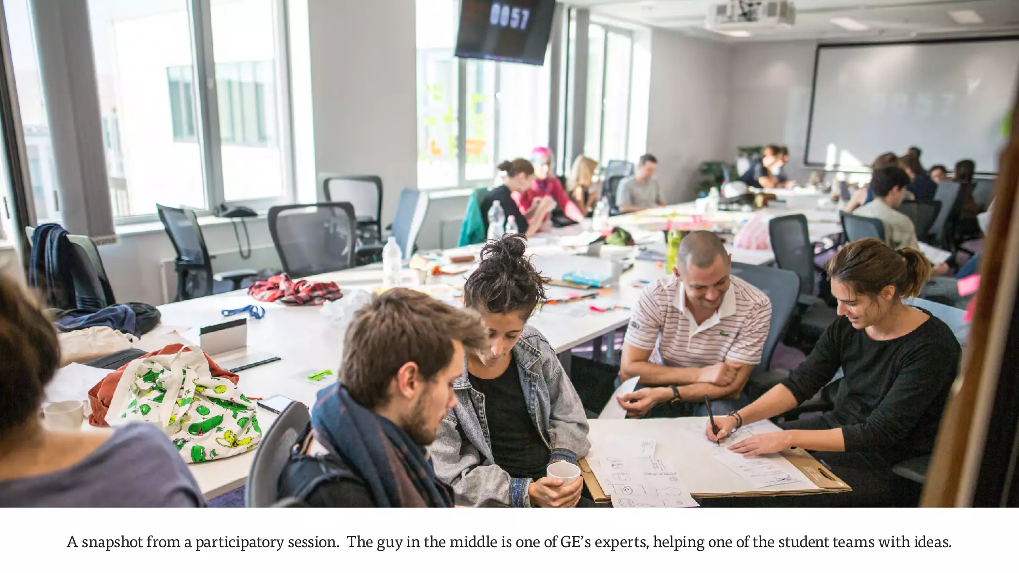A snapshot from a participatory session. The guy in the middle is one of GE’s experts, helping one of the student teams with ideas.
 