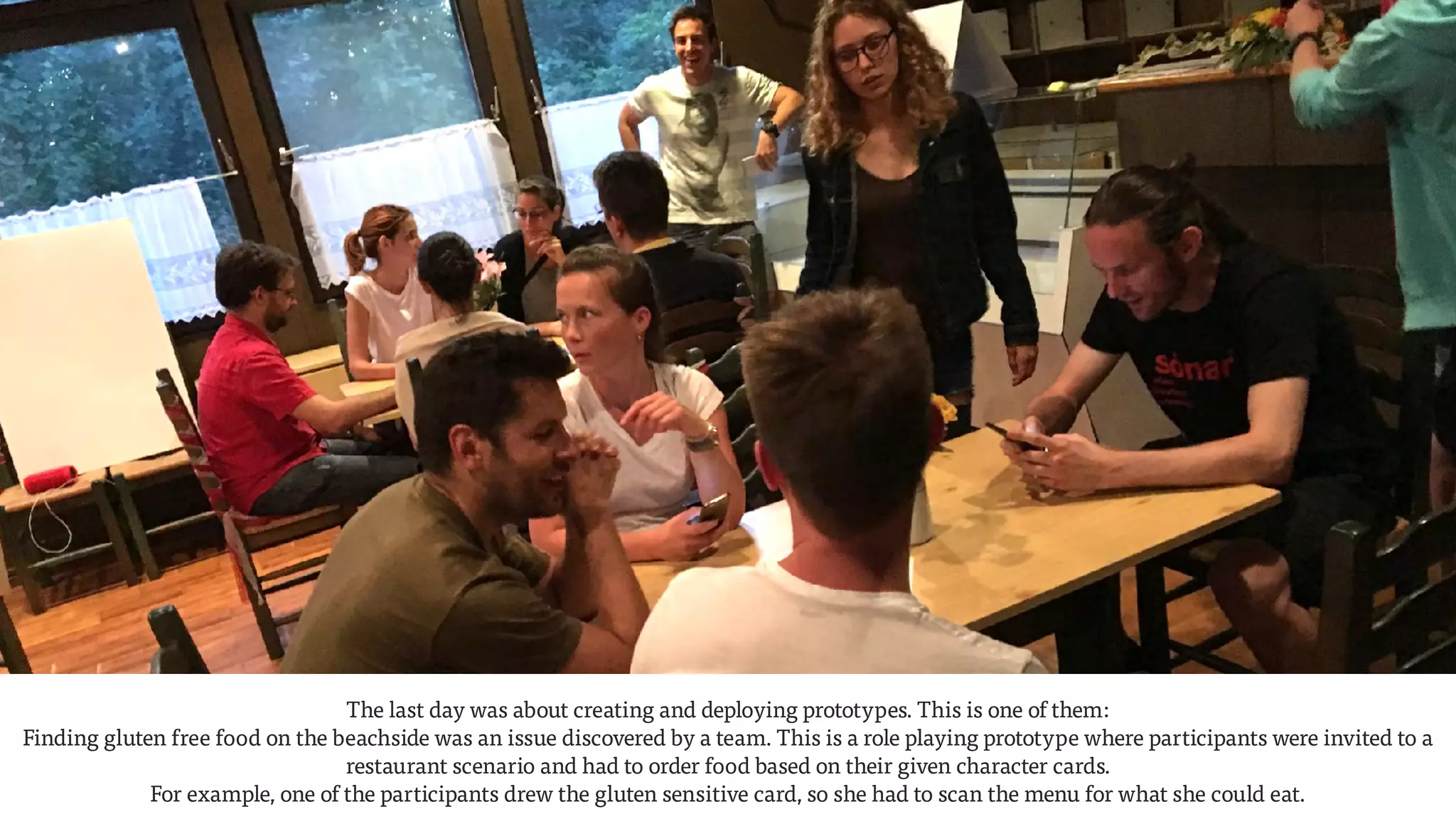 The last day was about creating and deploying prototypes. This is one of them:  
Finding gluten free food on the beachside was an issue discovered by a team. This is a role playing prototype where participants were invited to a
restaurant scenario and had to order food based on their given character cards.  
For example, one of the participants drew the gluten sensitive card, so she had to scan the menu for what she could eat.
 