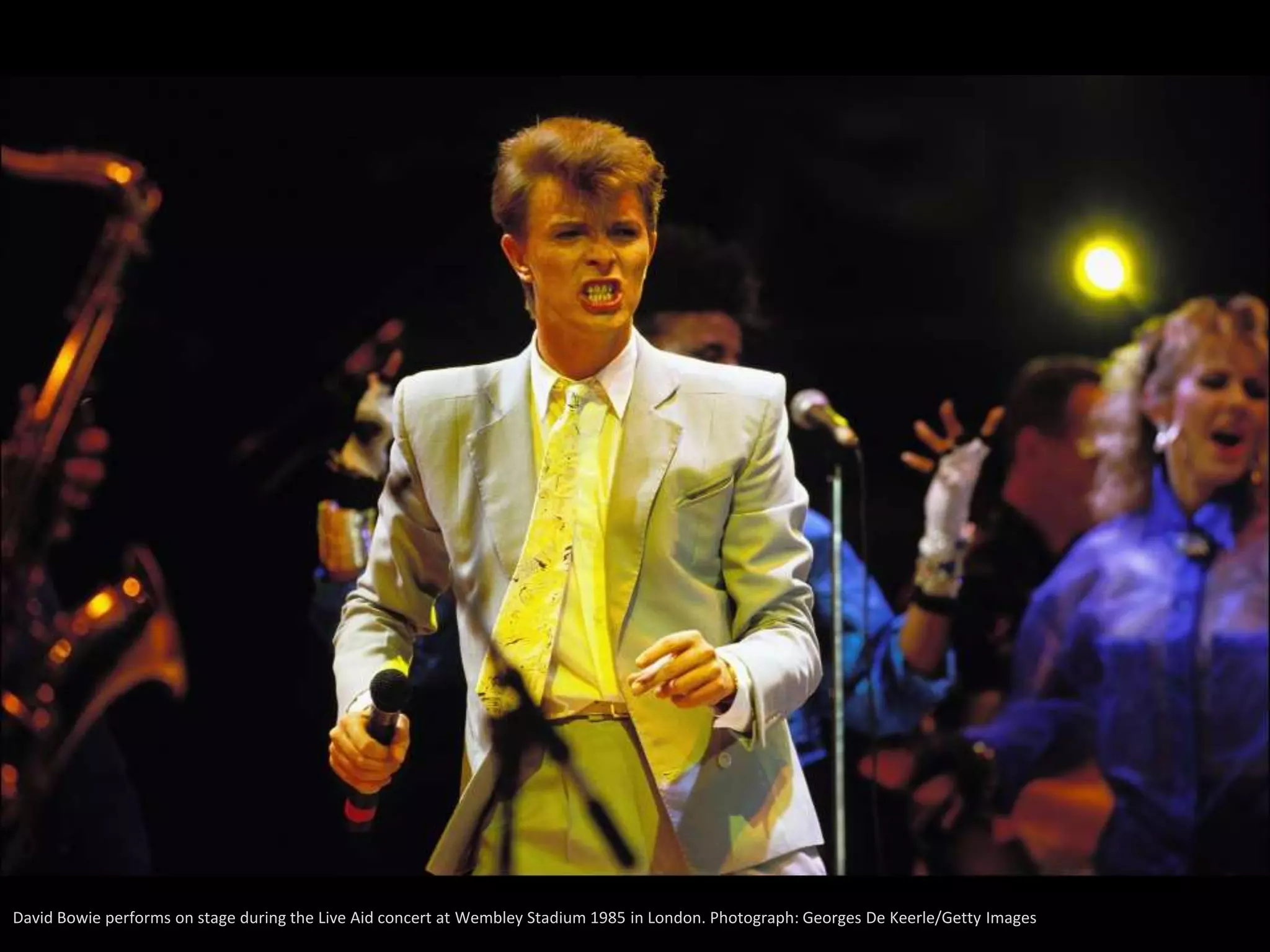 David Bowie performs on stage during the Live Aid concert at Wembley Stadium 1985 in London. Photograph: Georges De Keerle/Getty Images
 