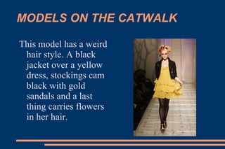 MODELS ON THE CATWALK This model has a weird hair style. A black jacket over a yellow dress, stockings cam black with gold sandals and a last thing carries flowers in her hair. 