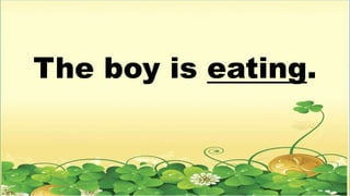The boy is eating.
 