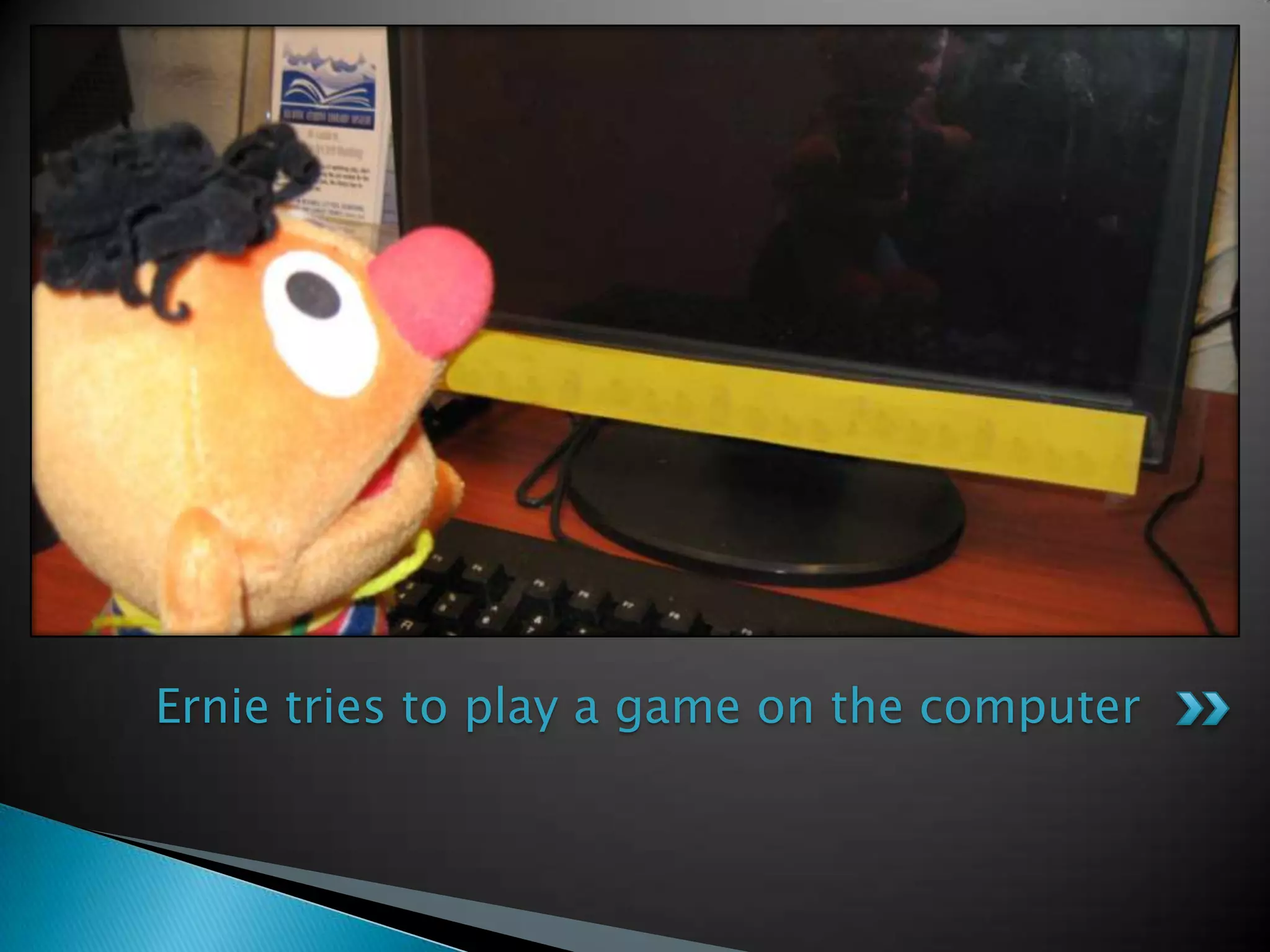 Ernie tries to play a game on the computer