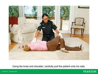 Using the knee and shoulder, carefully pull the patient onto his side.
 