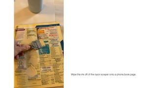 Wipe the ink off of the razor scraper onto a phone book page.
 