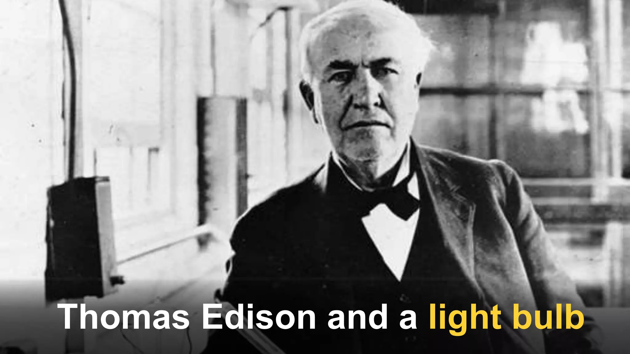 Thomas Edison and a light bulb
 