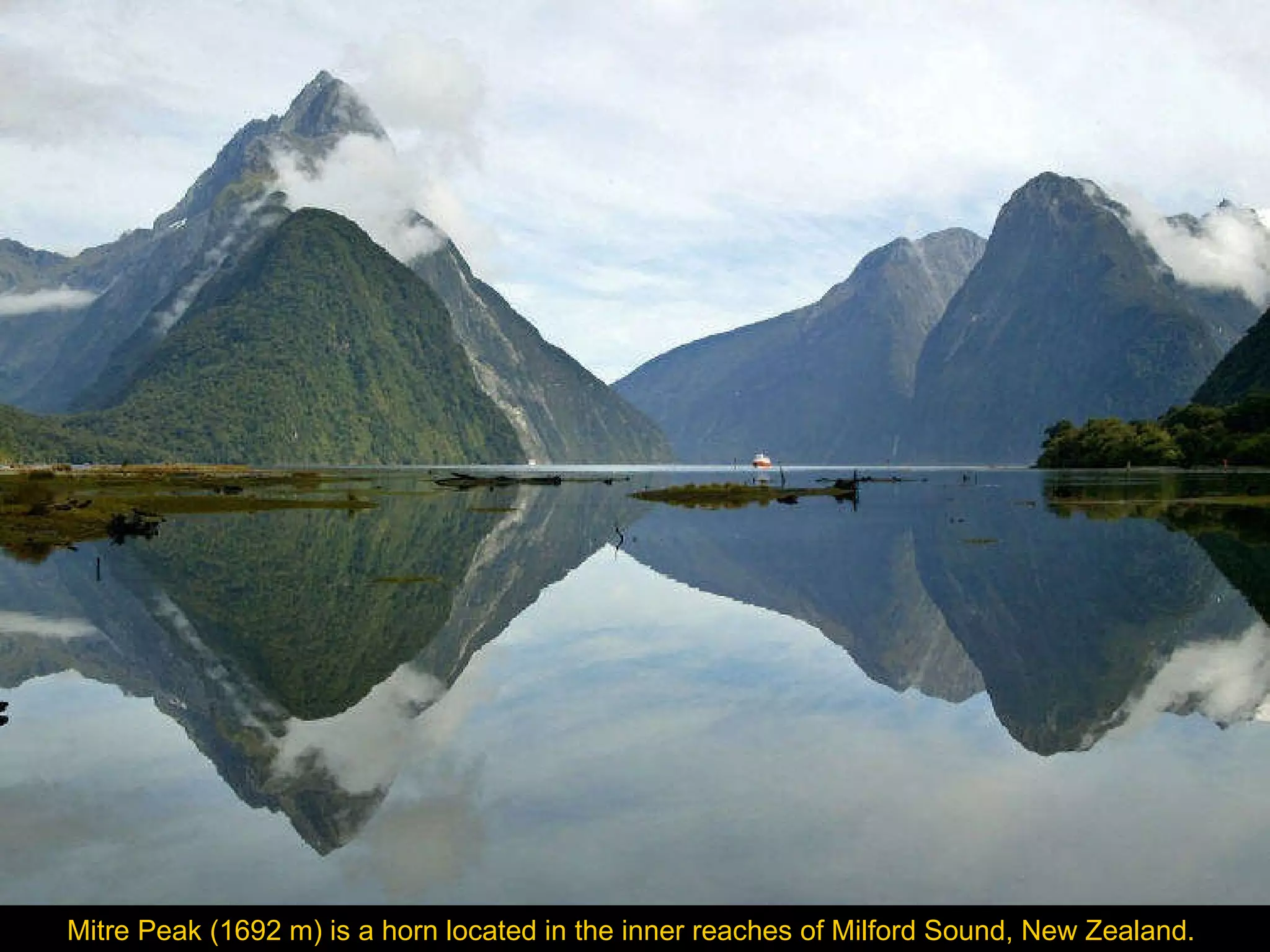 Mitre Peak (1692 m) is a horn located in the inner reaches of Milford Sound, New Zealand.  