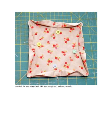 Now find the point where both folds join (see picture) and make a stitch.
 