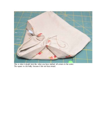 This is what it should look like when you have stitched all corners in the centre.
The square is a bit bulky because it has not been ironed.
 