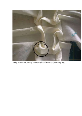 Finding the folds and pushing them to the correct sides as per picture may help.
 