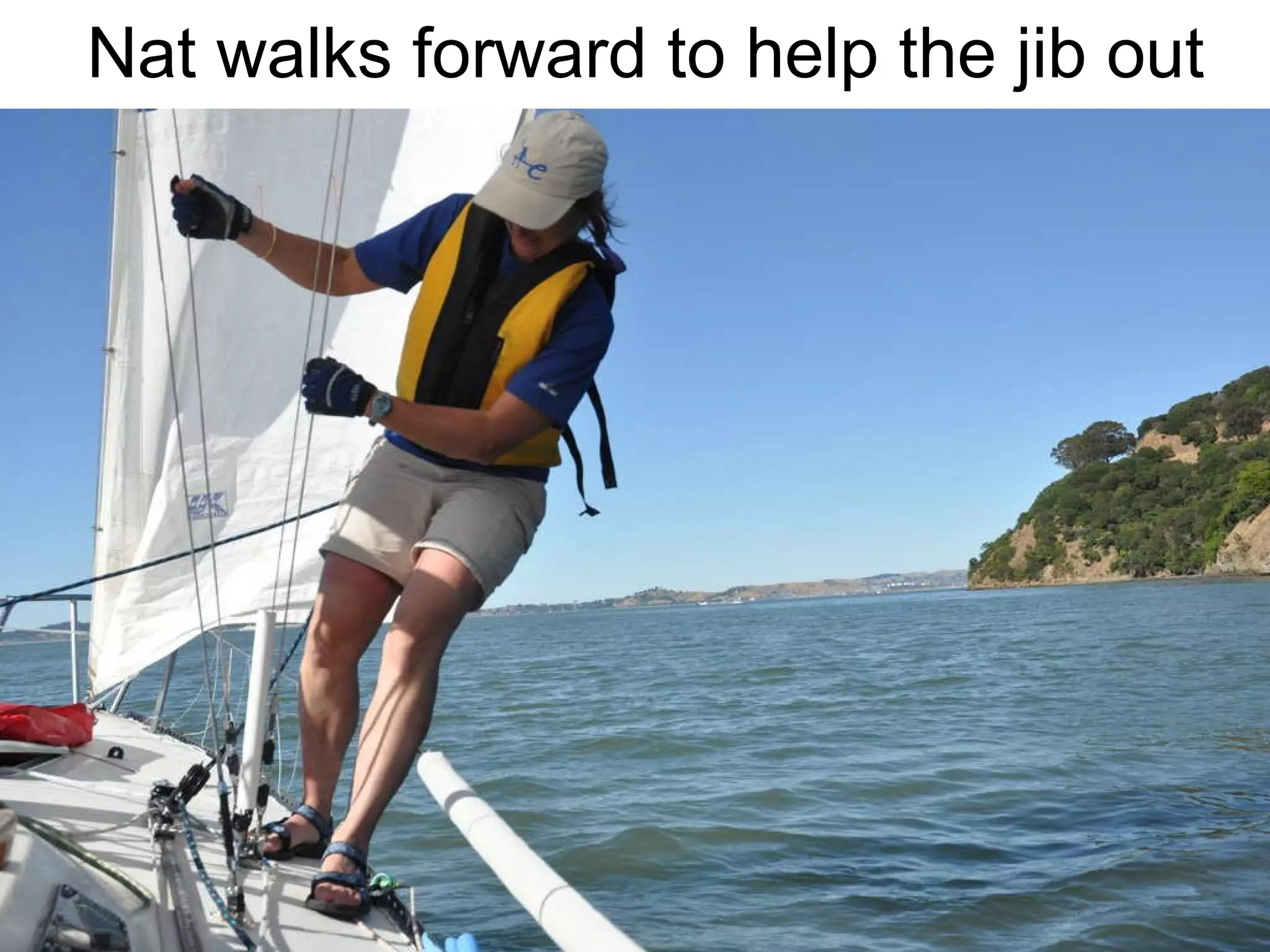 Nat walks forward to help the jib out 