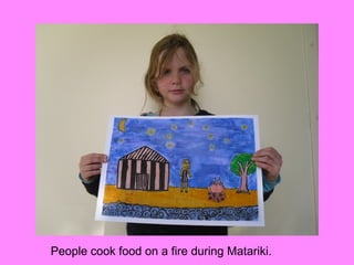 People cook food on a fire during Matariki.
 